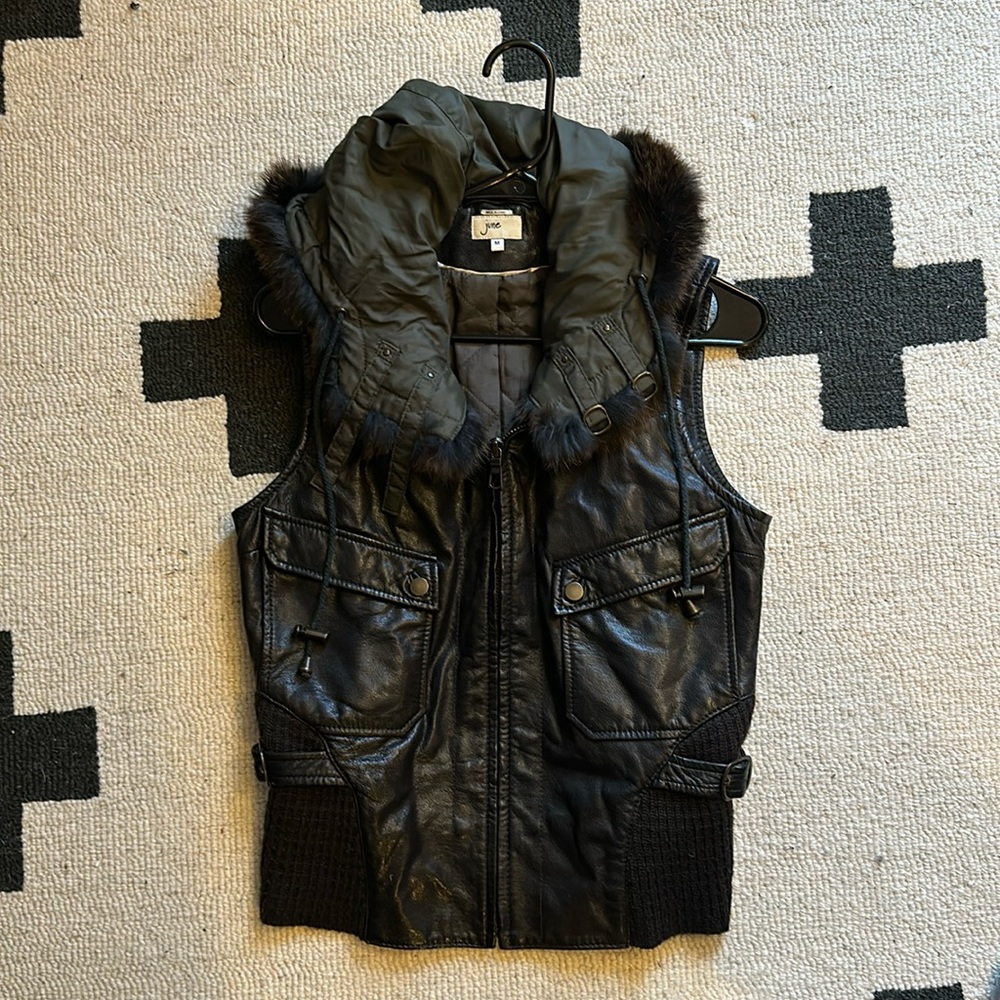 Brown leather vest with fur trim hood
